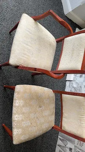 Cleaned patterned chair beside a visibly soiled matching chair for comparison