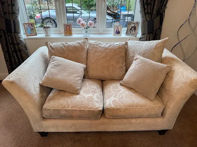 Clean cream patterned sofa with cushions