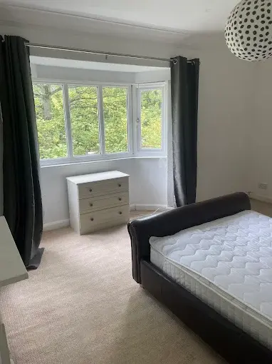 Uncovered mattress in a bedroom